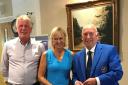 Amanda Cooper and Terry Hale from Marlborough GC receive their prize from the East Berks captain Peter Stevens