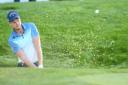 Danny Willett of England plays out of the bunker on the 18th hole during the BMW PGA Championship Day 3