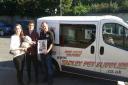 Jenni Brown and Lonn Brown with Andrew Green of Tadley Pet Supplies holding champion Meowbot
