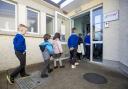 Pupils of Scoil Naomh Lorcan in Omeath walk into school after their lunch break, as junior Infants to 3rd class pupils return to school. More than 300,000 students have returned to classrooms across the country for the first time since December after
