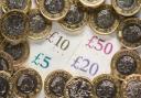 File photo dated 26/01/18 of a UK five pound, ten pound, twenty pound and fifty pound notes with one pound coins, as city bonuses have increased at more than twice the speed of wages since the 2008 financial crash, research suggests..