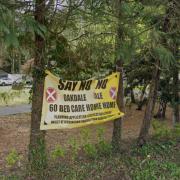 A banner opposing plans for a large new care home on Lower Wokingham Road