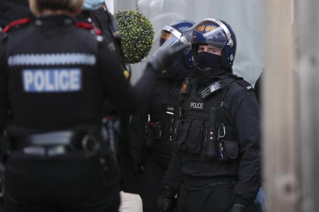 Officers from Thames Valley Police take part in raid on a property. (Stock image)