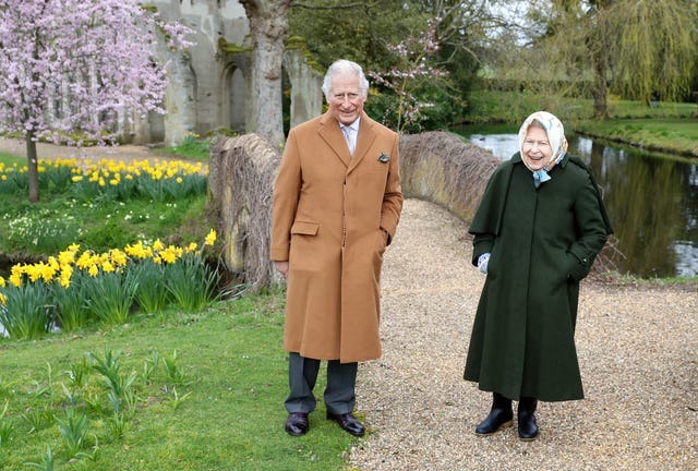 The Queen and her eldest son smiled as they walked around the grounds of Frogmore House (Chris Jackson/PA)