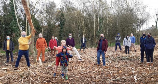 Bracknell News: Neighbours and Liberal Democrats protesting the 'deforestation' at Swallows Meadow in November last year. Credit: Wokingham Liberal Democrats