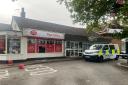 LIVE: Police tap off shop after incident