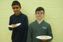 Saqib Khan and William Clark, both 14, enjoy their well earned cake - Arbour Vale maths day, PIC: Nic Brunetti