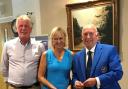 Amanda Cooper and Terry Hale from Marlborough GC receive their prize from the East Berks captain Peter Stevens