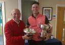 Oliver Bryant receiving the trophies from Peter Stevens, theEast Berks club captain