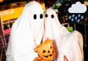 File photo of two people dressed as ghosts on Halloween