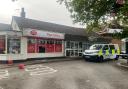LIVE: Police tap off shop after incident