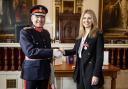 Ms Jaime Thurston BEM receives the British Empire Medal for  Services to Charity from the Lord Lieutenant, Mr Andrew Try at a  ceremony at the Windsor Guildhall on Tuesday 5 March 2024
