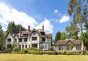 A view of Charlecombe Hall house and cottage from its grounds in Sunningdale. Credit: Savills