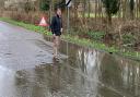 Wayne Smith inspects flooding on Blakes Lane, just off the A4 Bath Road