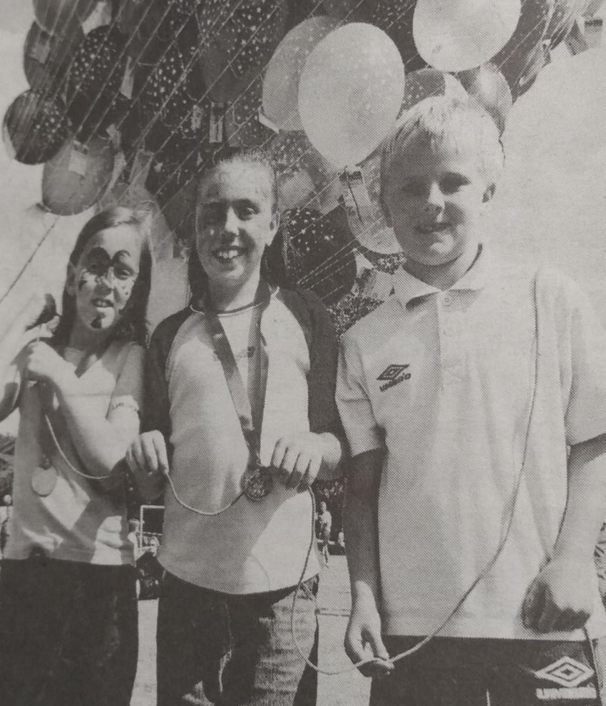 Emily Brown, Sarah Forde and Steven Jervis with the balloons in July 2001