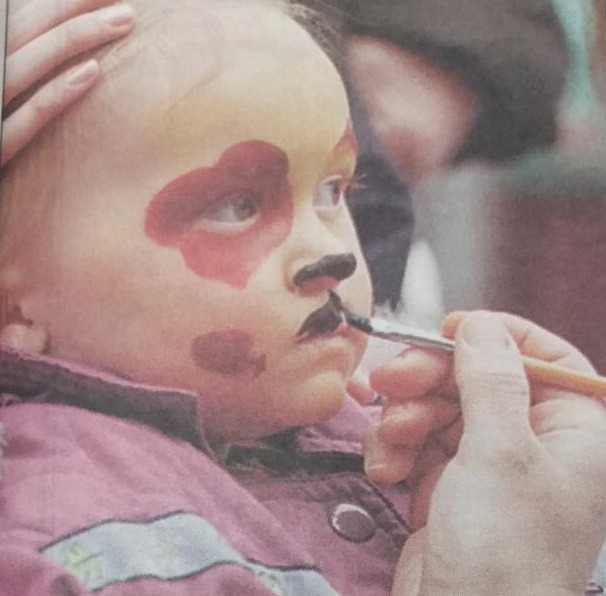 A youngster has her face painted at the fun day 