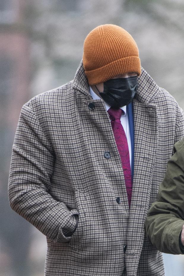 Bracknell News: Oliver Perry Smith covered his face using a mask and a woollen hat. Credit: Hyde News and PIctures