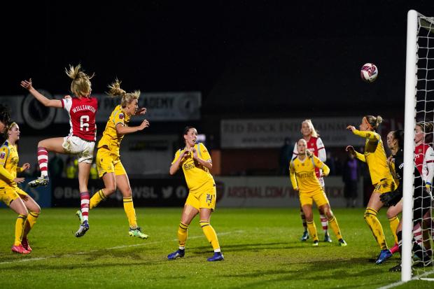 Leah Williamson heads in Arsenal's third goal. Image by: PA