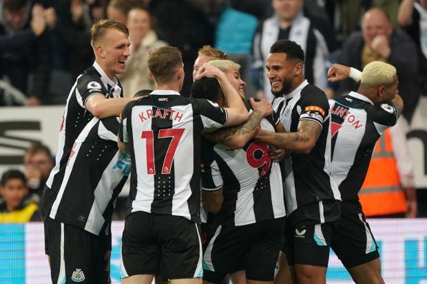 Newcastle players celebrate their first goal