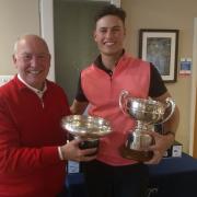 Oliver Bryant receiving the trophies from Peter Stevens, theEast Berks club captain
