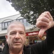 Thumbs down! David Toomey was unhappy at not receiving his pay-out at the Ladbrokes in Bracknell High Street. Credit: David Toomey