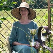 Michelle MacDonald holds the Duchess of Rutland Trophy for best in show at the Belvoir Castle Garden and Flower Show