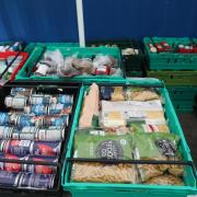File photo dated 03/03/21 of food laid out in crates at a food bank in north London. Four out of five low-paid workers say the cost-of-living crisis is the worst financial period they have ever faced, new research suggests. Issue date: Friday September