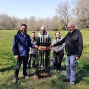 Richard Everett, chief forester at The Crown Estate joins members of the heritage parks team, and volunteers from their dedicated gardening group, to unveil the new plaque.