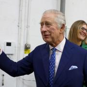King Charles III waving during a visit to the Milton Keynes food bank, as millions watching the coronation around the world are to be asked to cry out and swear allegiance to the King, with the public given an active role in the ancient ceremony for the