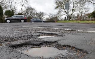 A series of potholes on a stretch of road